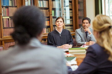 Judge and lawyers talking in chambers