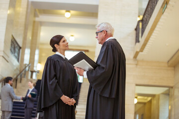 Judges talking in courthouse
