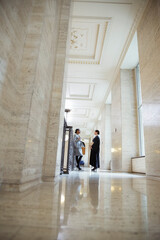 Judge and lawyer talking in courthouse