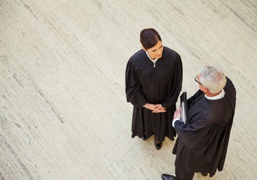 Judges talking in courthouse