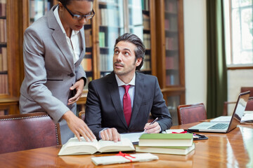 Lawyers doing research together in chambers