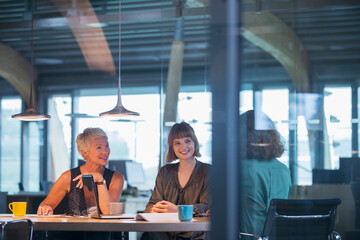 Businesswomen talking in office meeting