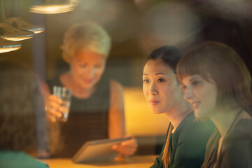 Businesswomen talking in office meeting