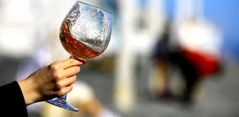 a glass of port wine in hand, portugal drink alcohol