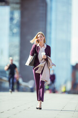 Businesswoman talking on cell phone in city