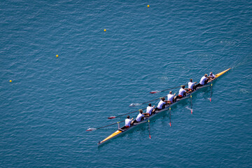 Men's eight rowing on Lake Bled