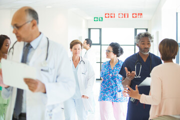 Doctors and nurses in hospital corridor