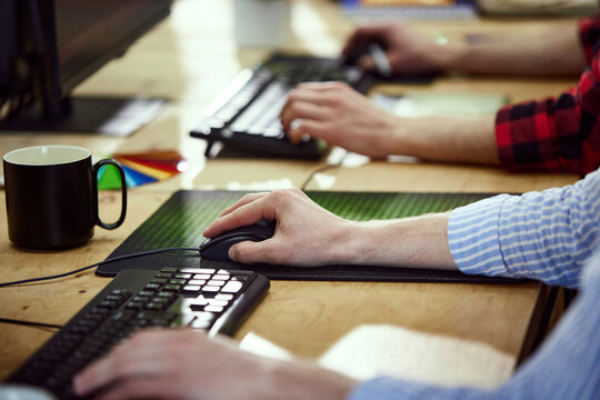 Close-up image of hands, graphic designers, business people working, using computer keyboard. Concept of creative occupation, business, profession, office lifestyle, art