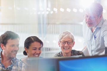 Students working at computer in adult education classroom