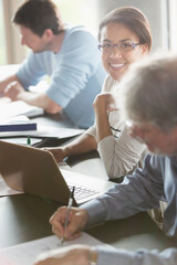 Portrait smiling woman studying in adult education classroom