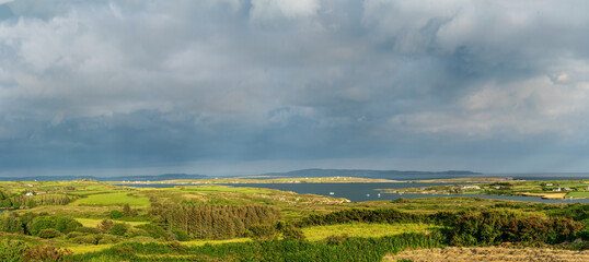 Panoramic view looking from Lowertown South toward Long Island side in summer on cloudy day. Ireland,west Cork.