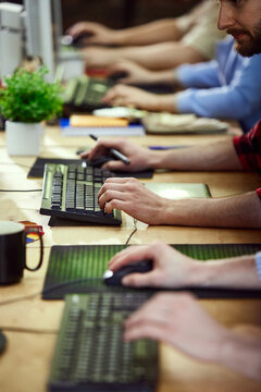 Close-up image of hands, graphic designers, business people working, using computer keyboard and tablets. Concept of creative occupation, business, profession, office lifestyle. Unfocused background