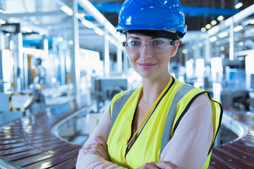 Portrait confident female worker hard-hat protective eyewear in factory - obrazy, fototapety, plakaty
