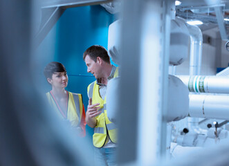 Workers talking in factory