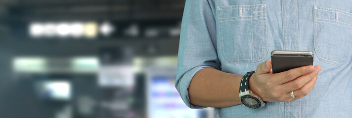 Man holding smartphone device  touching screen