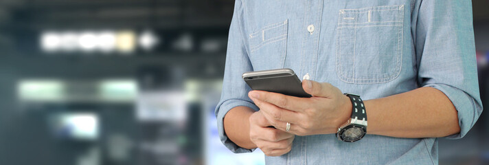 Man holding smartphone device  touching screen