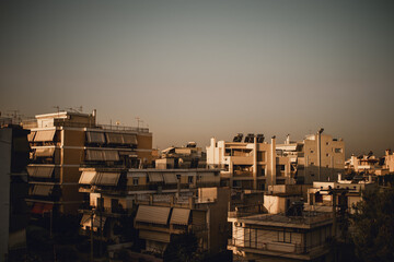 Greek apartment buildings in Athens during the sunset