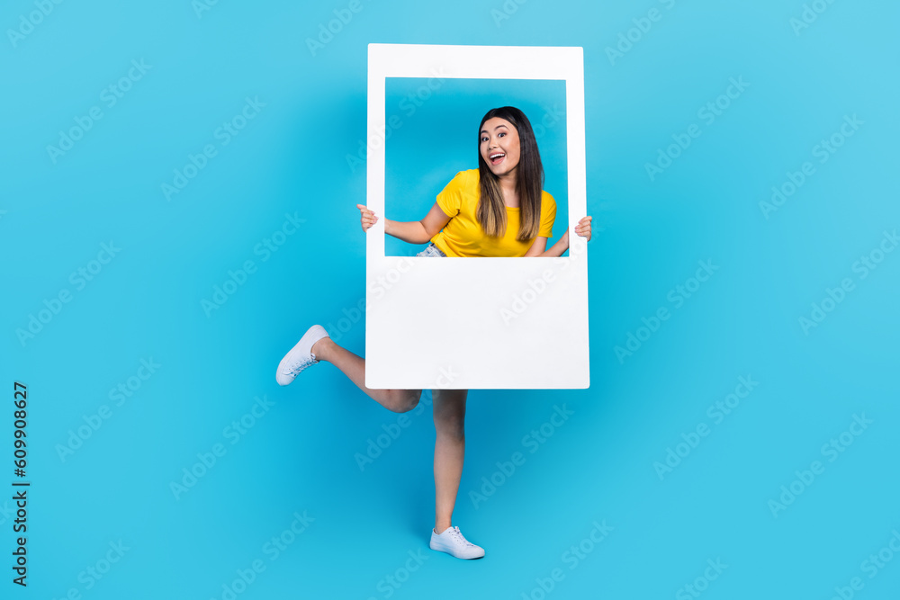 Sticker Full size portrait of funky carefree girl hold paper album set card isolated on blue color background