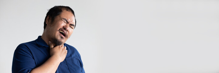 Obraz premium Middle aged asian man having sore throat from cold, flu, inflammation or infection