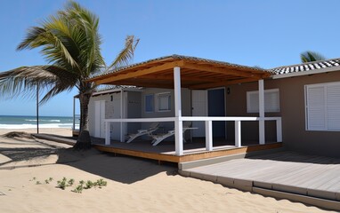 Fototapeta premium Beach hut on the beach with palm tree. Generative AI.