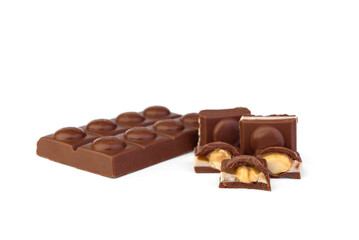 Milk chocolate with toffee and whole nut on a white background.