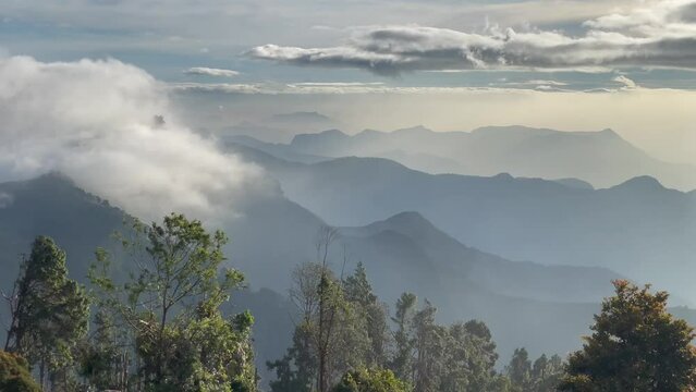 Stunning Landscape Silhouette Of Mountains With Clouds Above In Kodaikanal, India.