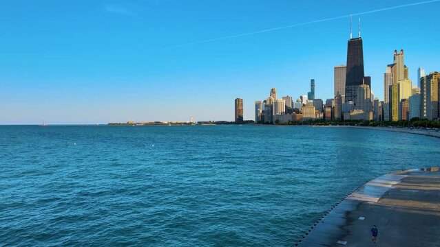 aerial drone view of Chicago metropolis from the lake during late evening.  the beautiful skyscraper showcases of the wonders of the city architecture. related to business finance and travel