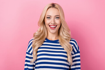 Photo of young optimistic woman wear striped pullover tongue teeth tongue girlish wavy blonde flirting isolated on pink color background