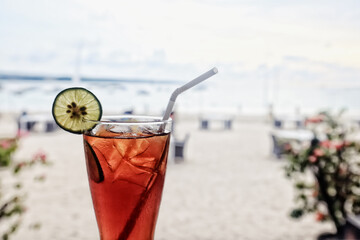 iced tea with ice and lemon at the beach bar
