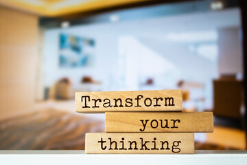 Wooden blocks with words 'Transform your thinking'