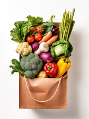 Assortment of vegetables in paper bag isolated on white background