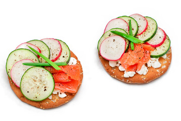 Crispy Cracker Sandwiches with Salmon, Cucumber, Radish, Cottage Cheese and Green Onions - Isolated on White. Easy Breakfast. Quick and Healthy Sandwiches. Crispbread with Tasty Filling - Isolation
