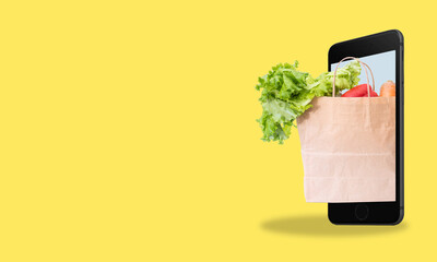 Modern art collage cell phone grocery bag on yellow background with space for text.