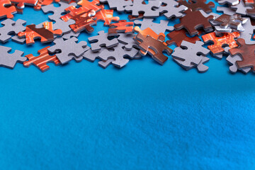 Mixed Peaces of a Colorful Jigsaw Puzzle Lie on the Blue Background With Copy Space - Strategy and Solving Problem Concept