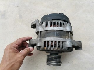 Hand holding a car battery charger