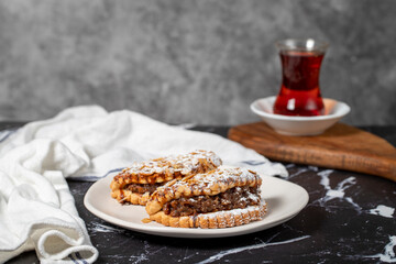 Apple cookies. Tasty cookies filled with applesauce on a dark background