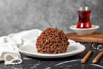 Chocolate cake. Mole cake with chocolate chips on dark background