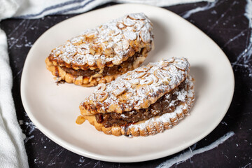 Apple cookies. Tasty cookies filled with applesauce on a dark background
