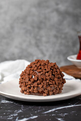 Chocolate cake. Mole cake with chocolate chips on dark background