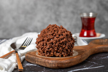 Chocolate cake. Mole cake with chocolate chips on dark background