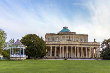 Pittville Pump Room and old spa mineral water buildings in Pittville Park, Cheltenham, Gloucestershire, England