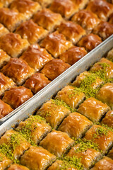 Turkish baklava. Pistachio and walnut baklava. Turkish cuisine delicacies. Delicious baklava with butter. Close up