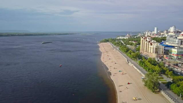 Early morning light on golden sand beach along wolga river in samara russia