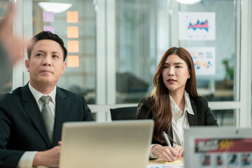 Modern Asian businessman with high confidence Committed to working together as a harmonious team Having a professional planning meeting at the company