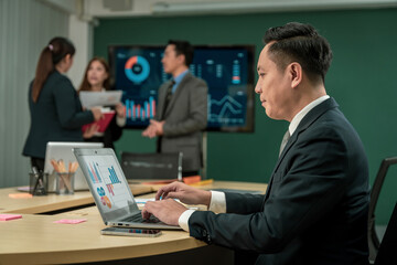 Modern Asian businessman with high confidence Committed to working together as a harmonious team Having a professional planning meeting at the company