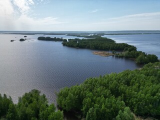 Drone view. Sunny weather. Green islands in the floods of the Volga.