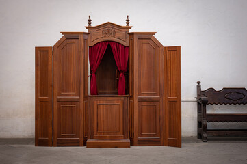 Detail of an old wooden confessional in a Spanish church, in Las Palmas de Gran Canaria
