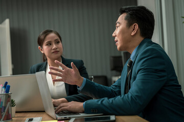 Modern Asian businessman with high confidence Committed to working together as a harmonious team Having a professional planning meeting at the company