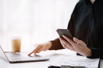 Women use laptop computers for laptop payments, online shopping, omni channels, sitting at desks.