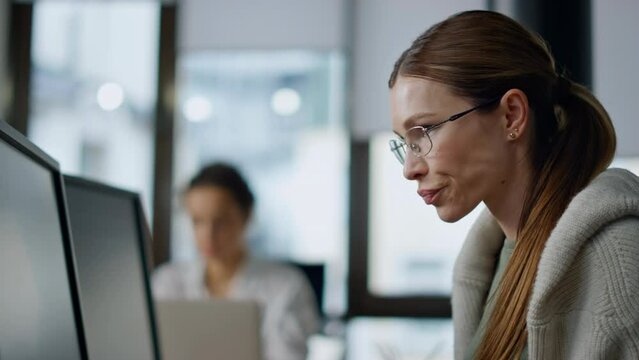 Pensive developer analyzing software closeup. Thoughtful woman looking computer